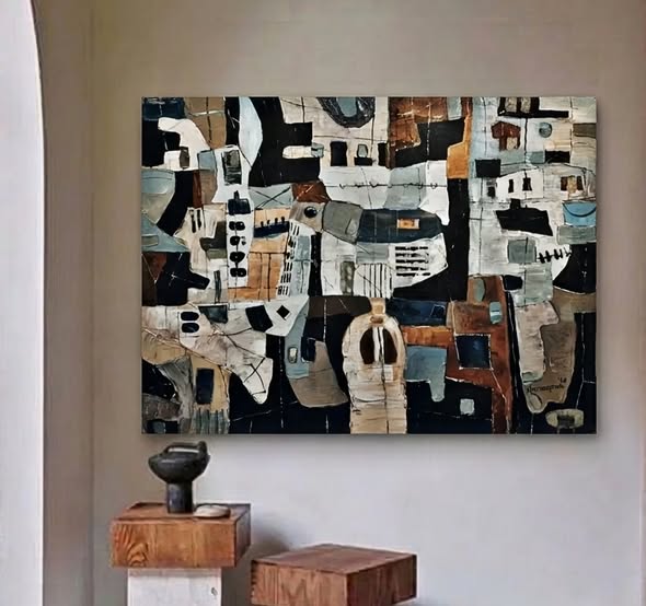 Abstract artwork on a wall with wooden furniture below