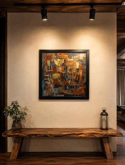 Abstract painting on a wall above a wooden bench with a plant and lantern.