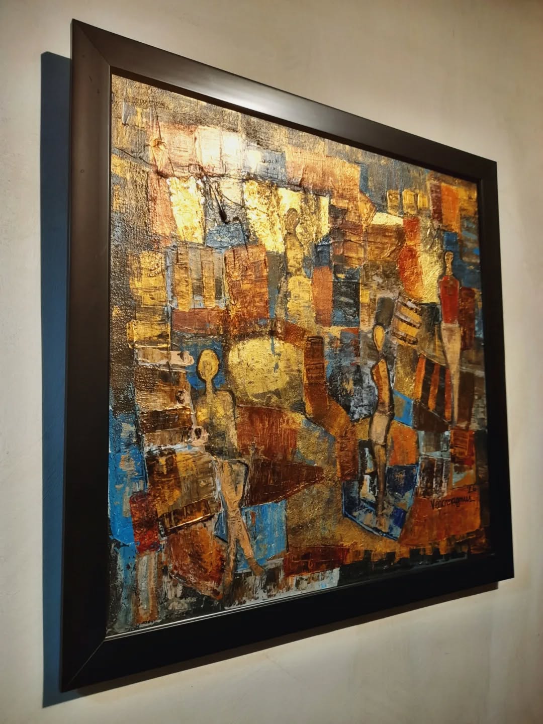 Abstract artwork with a black frame on a wall