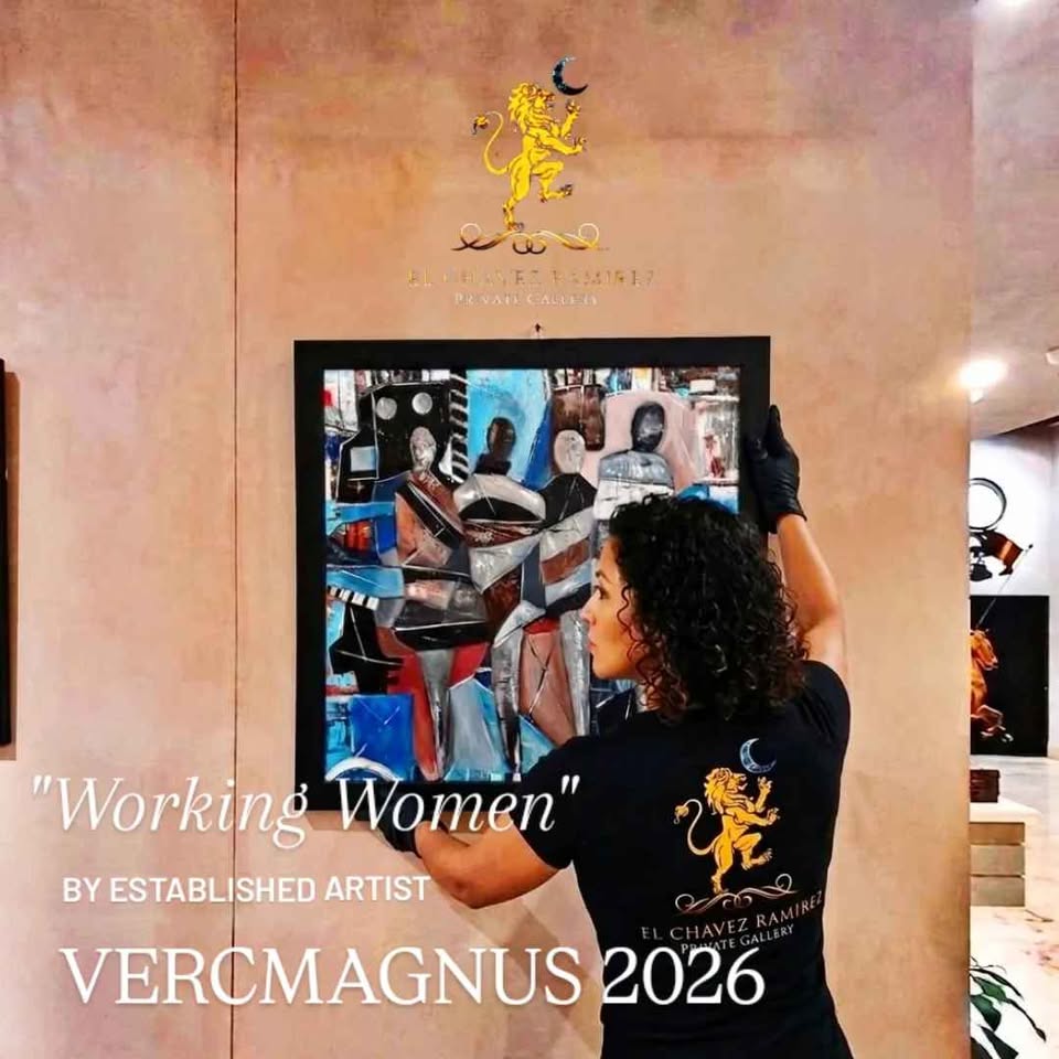 Woman hanging a painting titled 'Working Women' by VercMagnus 2026 in an art gallery.