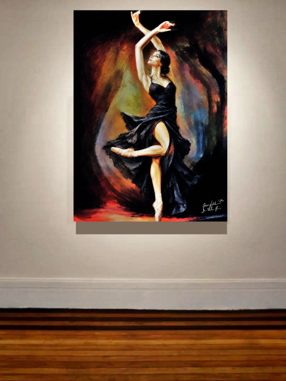 A vertical canvas painting of a ballerina in a black dress, displayed on a light beige wall above a wooden floor.