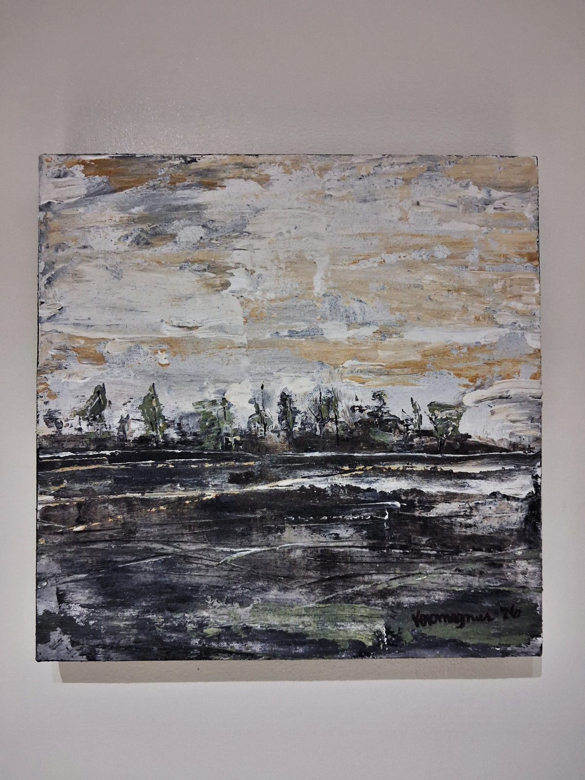 An abstract landscape painting on canvas, featuring a textured sky in shades of beige, gray, and white, with a dark, expressive ground in black, gray, and green tones, hanging on a neutral wall.