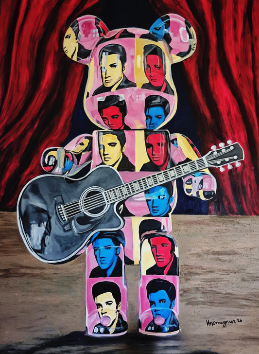 A colorful pop-art style bear figure holding an acoustic guitar, with repeated portrait panels in pink, blue, yellow, and red, set against a red curtain background and standing on a wooden surface.